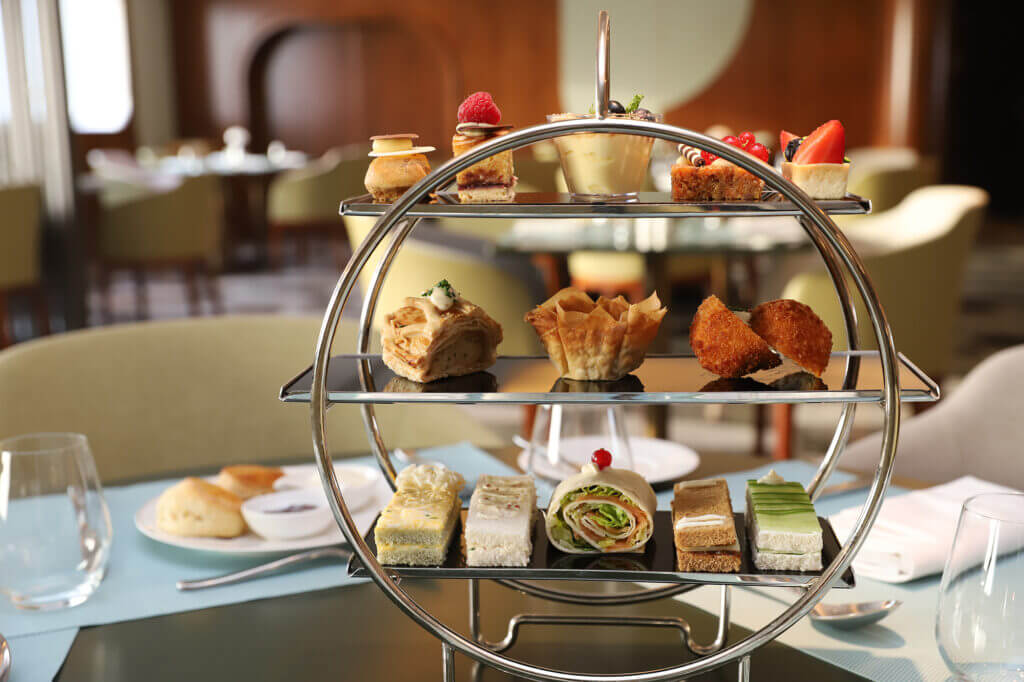 Indulge in the Finest British Tradition with Afternoon Tea on the Queen Elizabeth 2